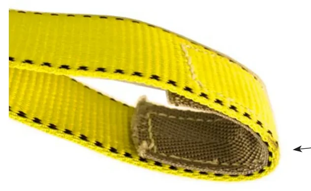 Looking into the loop eye of a 2 inch web sling: a darker wear pad is sewn inside the throat of the eye, beneath the yellow webbing